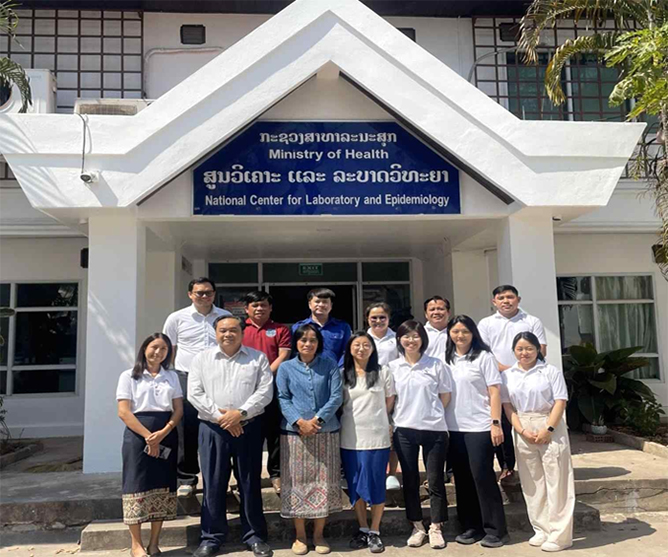 Group photo of KDCA experts and LAO PDR Ministry of Health officials at NCLE building